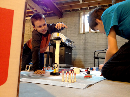 Quentin McQueary, the youngest member of the team, set up part of the scenario in the Woodard's basement where the team practiced before the competitions. 